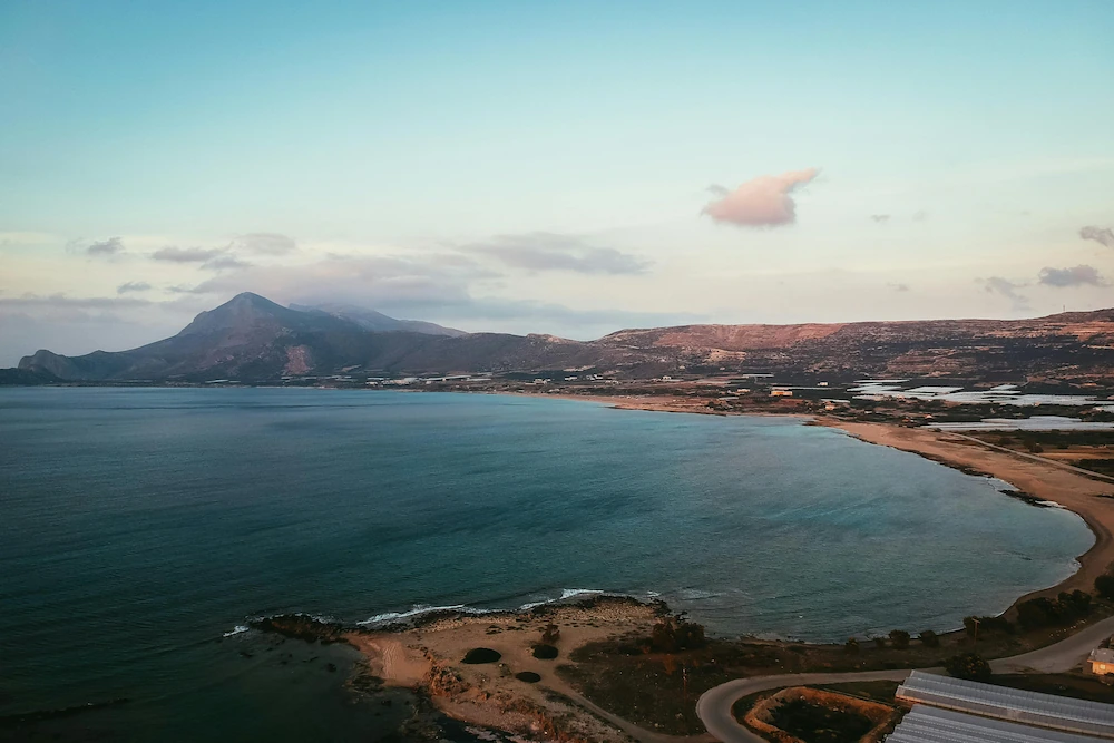 A picturesque bay in Crete, surrounded by mountains and the azure sea.